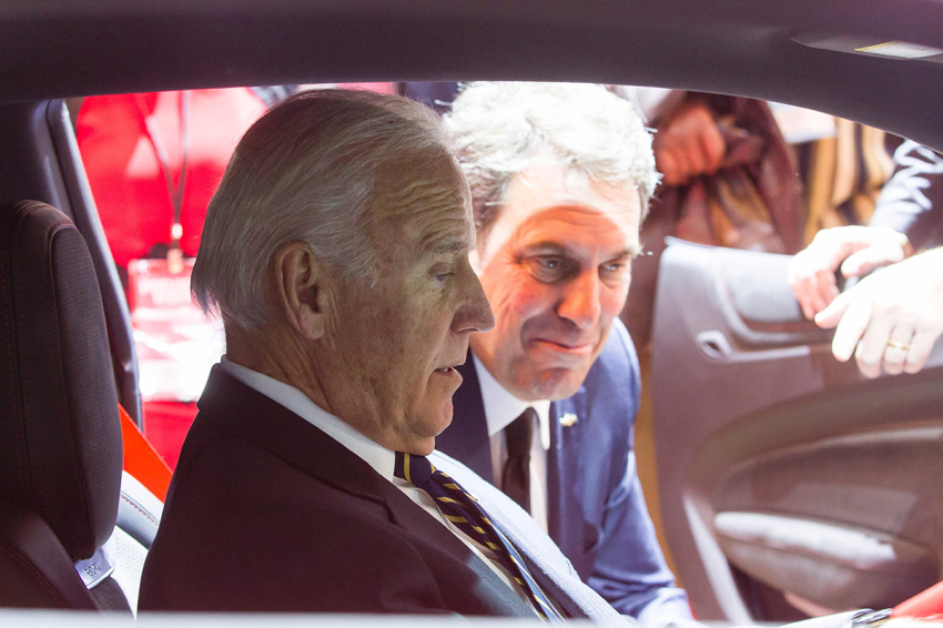 US Vice President Joe Biden (L) speaks with Mark Reuss, President of General Motors North America as he sits in a Corvette during a visit to the 2017 North American International Auto Show in Detroit, Michigan, January 10, 2017. 