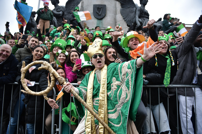 Revelers attend the St Patrick's Day Parade on March 17, 2023, in Dublin, Ireland. March 17 is the feast day of Saint Patrick commemorating the arrival of Christianity in Ireland.