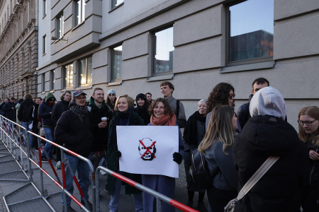 Expatriate Russian citizens, including a young group with an anti-Vladimir Putin placard, wait to vote at the Russian Embassy in Russian elections on March 17, 2024, in Berlin, Germany. Presidential elections in Russia, which are taking place without any meaningful opposition candidates allowed, will conclude today with President Vladimir Putin all but certain to be reelected.