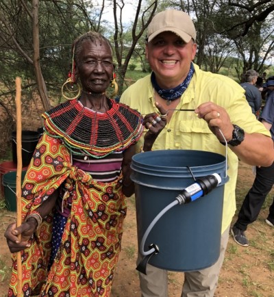 Christopher Beth, founder of The Bucket Ministry, distributes water filters in Kenya that give residents access to clean water. 