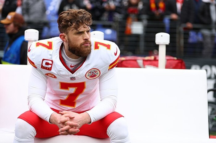 Kansas City Chiefs kicker Harrison Butker sits on the sideline of the AFC Championship in Baltimore, Maryland, on January 28, 2024.