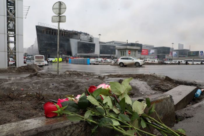 Flowers are seen left at the scene of the gun attack at the Crocus City Hall concert hall in Krasnogorsk, outside Moscow, on March 23, 2024. Gunmen who opened fire at a Moscow concert hall killed more than 60 people and wounded over 100 while sparking an inferno, authorities said on March 23, 2024, with the Islamic State group claiming responsibility. 