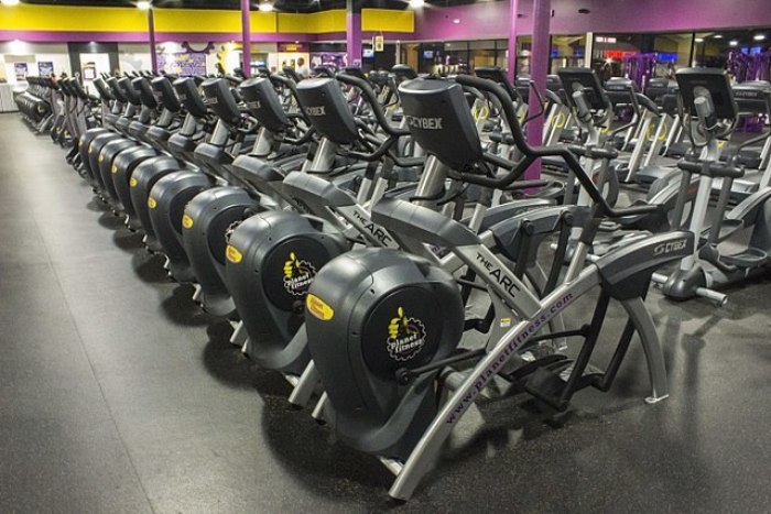 A row of Cybex Arc Trainers lined up at a Planet Fitness in Spring Branch, Houston, Texas.