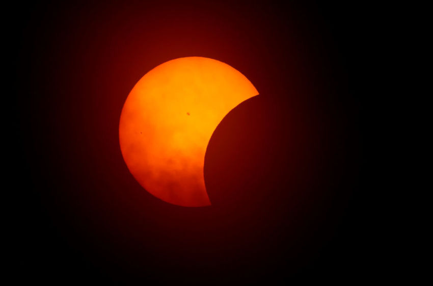 The moon begins to eclipse the sun on April 8, 2024 in Fort Worth, Texas. Millions of people have flocked to areas across North America that are in the "path of totality" in order to experience a total solar eclipse. During the event, the moon will pass in between the sun and the Earth, appearing to block the sun.