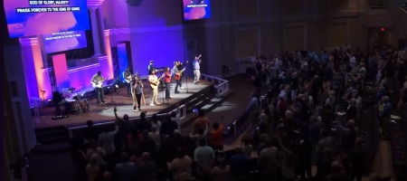 Participants take part in a worship service held at Harvest Church of Dothan, Alabama, in March 2024.