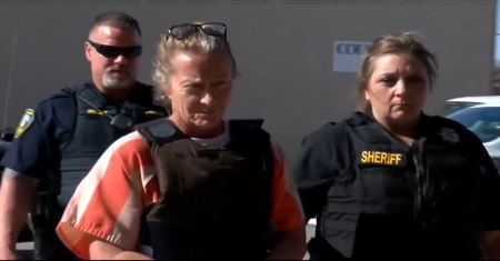 Cimarron County GOP Chair Tifany Machel Adams, 54, (in handcuffs) is among four suspects charged with the murder of Jilian Kelley, 39, and 27-year-old Veronica Butler. Adams is the paternal grandmother of Butler's children.