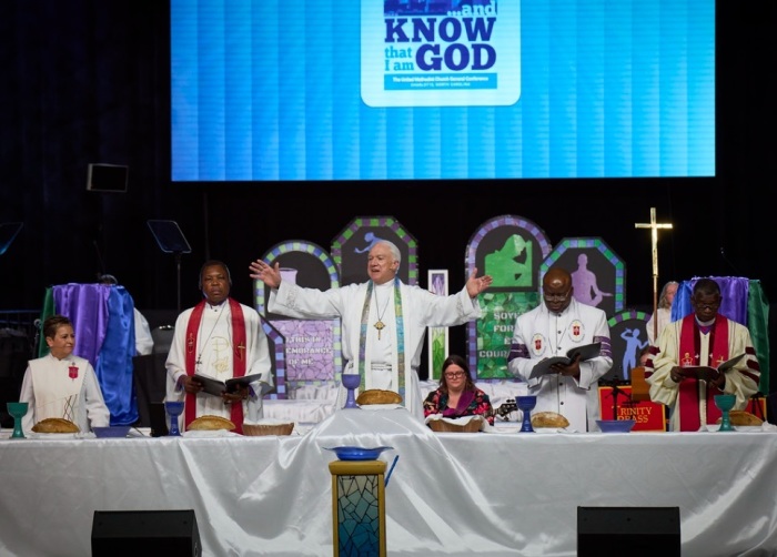 During the opening worship service of the United Methodist General Conference in Charlotte, North Carolina, on April 23, 2024, five United Methodist bishops celebrate communion with participants worldwide.