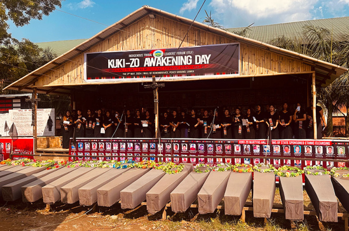On May 3, 2024, the Kuki-Zo tribal Christian community in Manipur, northeast India, marked the first anniversary of ongoing violence with a public prayer meeting at the “Wall of Remembrance” in Churachandpur district. The memorial displays the names and photos of all the victims, accompanied by empty coffins symbolizing their untimely deaths.