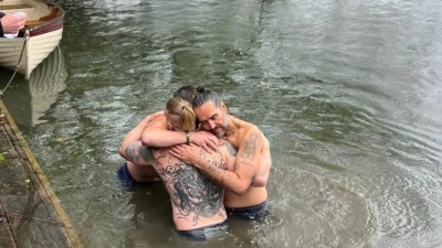 TV host and author Bear Grylls assisted with another friend in the baptism of comedian and actor Russell Brand in the River Thames on April 28, 2024.