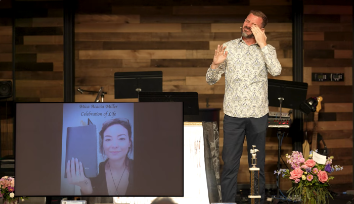 Pastor John-Paul Miller of Solid Rock at Market Common church in Myrtle Beach, South Carolina, wipes away tears as he eulogizes his late wife, Mica Miller, on May 5, 2024.