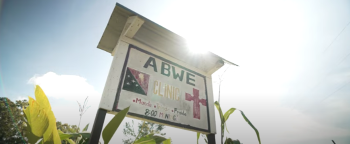 A sign welcomes visitors to the Association of Baptists for World Evangelism's clinic in Papua New Guinea. 