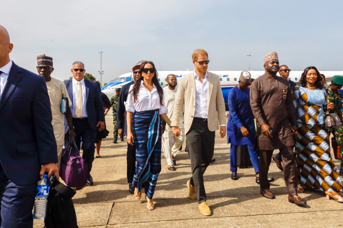 Prince Harry, Duke of Sussex and Meghan Markle, Duchess of Sussex, arrive at the Lagos airport for an official state welcome on May 12, 2024 in Lagos, Nigeria.