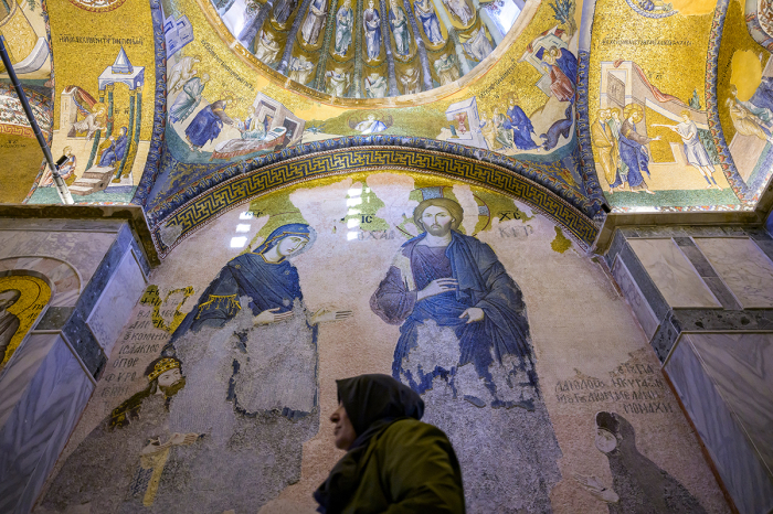 A visitor walks inside the ancient Orthodox church now converted as the Kariye Mosque in Istanbul, on May 6, 2024. Turkish President Recep Tayyip Erdogan on May 6, 2024, opened for worship a mosque converted from an ancient Orthodox church in Istanbul, four years after he ordered its transformation.