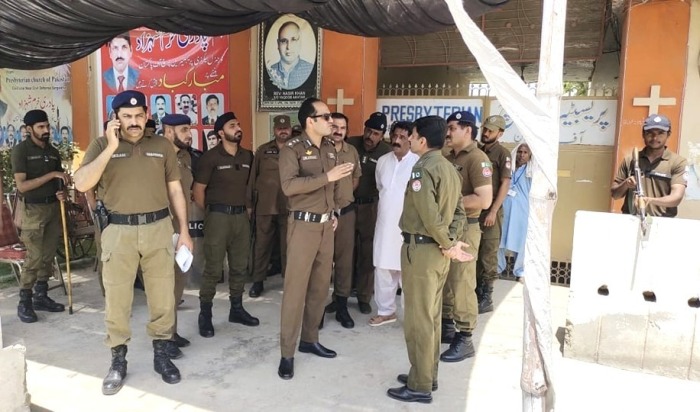 Police guard Presbyterian church building in Sargodha, Pakistan, on May 26, 2024. 