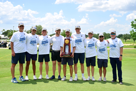 Members of the Colorado Christian University Men's Golf Team pose with a trophy after winning the NCAA National Title.