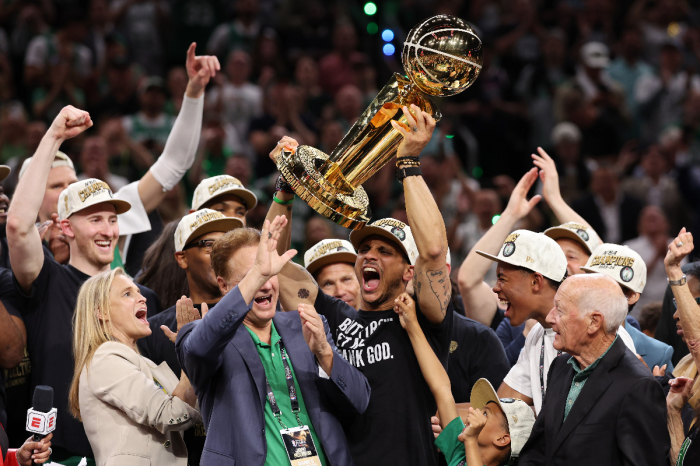 Head coach Joe Mazzulla of the Boston Celtics yells while lifting the Larry O’Brien Championship Trophy after Boston's 106-88 win against the Dallas Mavericks in gave five of the 2024 NBA Finals in Boston, Massachusetts, on June 17, 2024, 