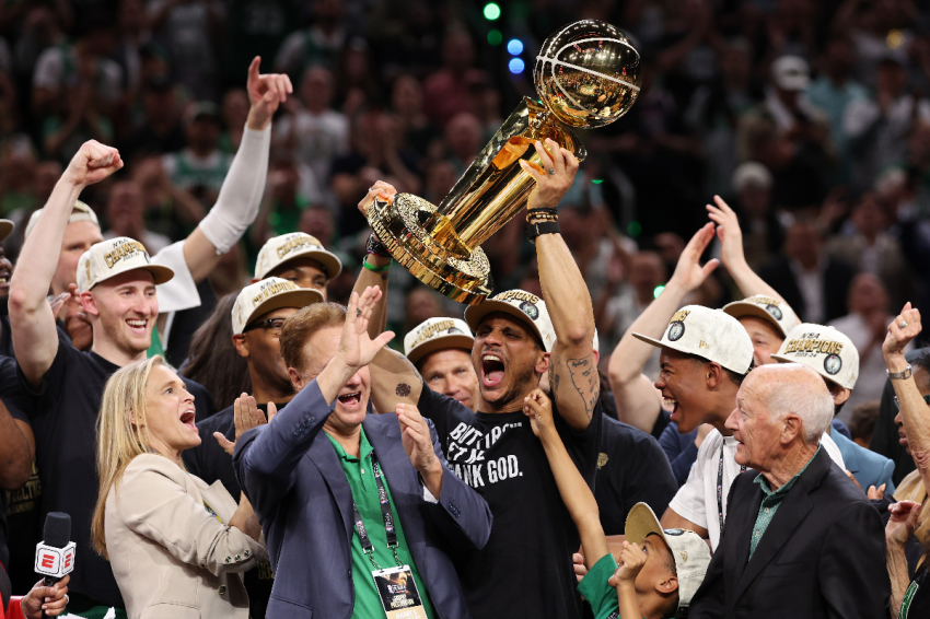 Head coach Joe Mazzulla of the Boston Celtics yells while lifting the Larry O’Brien Championship Trophy after Boston's 106-88 win against the Dallas Mavericks in gave five of the 2024 NBA Finals in Boston, Massachusetts, on June 17, 2024,