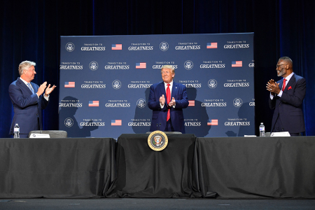 U.S. President Donald Trump (C), flanked by Bishop Harry Jackson (R, now deceased) and Pastor Robert Morris, hosts a roundtable with faith leaders, law enforcement officials, and small business owners at Gateway Church Dallas Campus in Dallas, Texas, on June 11, 2020.