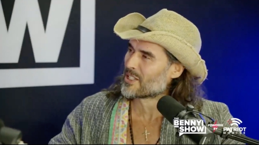 Comedian Russell Brand speaks with conservative influencer Benny Johnson during the 2024 Republican National Convention in July 2024.