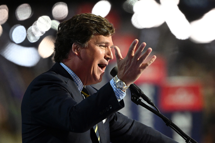 Tucker Carlson, founder of Tucker Carlson Network, speaks on stage on the fourth day of the Republican National Convention at the Fiserv Forum on July 18, 2024, in Milwaukee, Wisconsin. Delegates, politicians, and the Republican faithful are in Milwaukee for the annual convention, concluding with former President Donald Trump accepting his party's presidential nomination. The RNC takes place from July 15-18. 