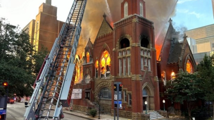 A four-alarm fire engulfs the historic 19th-century sanctuary of First Baptist Dallas in Dallas, Texas, on July 19, 2024.