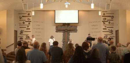 Attendees participate in a worship service held at Heartland Community Church of Lafayette, Indiana, on Sunday, Aug.18, 2024.