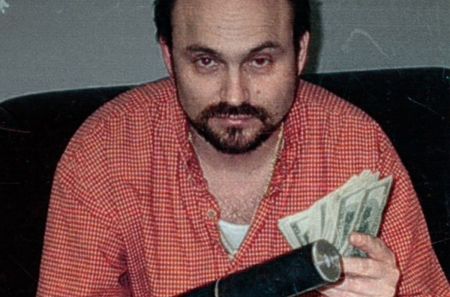 Pastor Dale Sutherland working undercover and counting money.