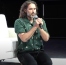 Russell Brand kneels in prayer at Tucker Carlson event, prays against 'dark and demonic forces'