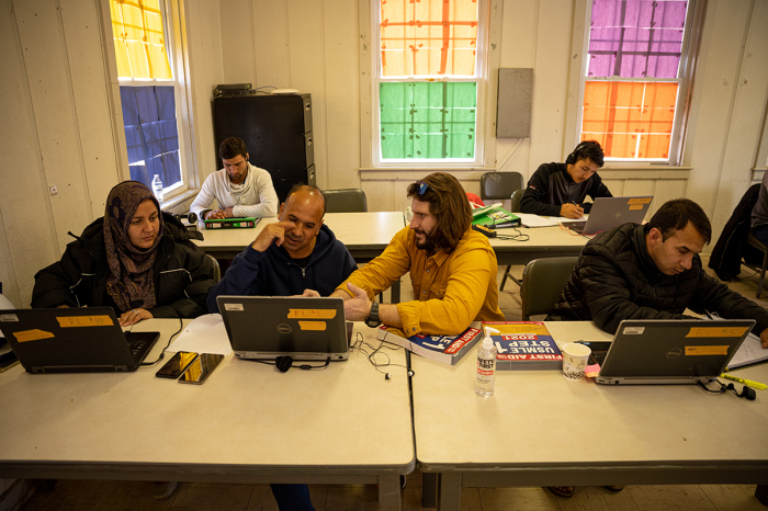 Afghan medical doctors study for American licensure in the computer lab at an Afghan refugee camp at Fort Pickett on Dec. 16, 2021, in Blackstone, Va. 