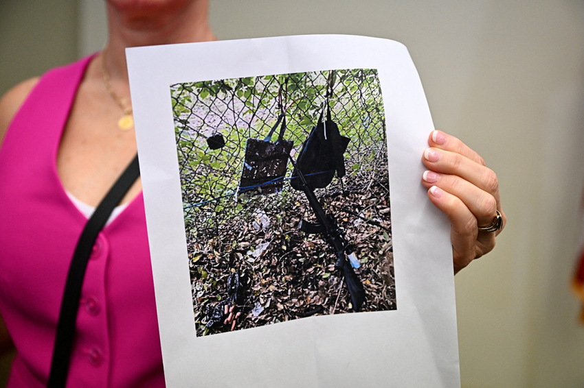 Press Information Officer Teri Barbera shows pictures of evidence found at the fence of former U.S. President Donald Trump's golf course at a press conference in West Palm Beach, Florida, on Sept. 15, 2024, following a shooting incident at Trump's golf course. Trump's campaign reported Sunday that there had been 