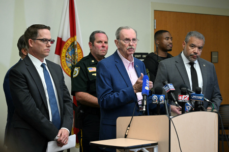 Palm Beach County Sheriff Ric Bradshaw (C) speaks alongside Jeffrey Veltri (L), special agent in charge of the Miami Field Office of the FBI and Rafael Barros, special agent in charge of the U.S. Secret Service's Miami field office, at a press conference in West Palm Beach, Florida, on Sept. 15, 2024, following an attempted assassination at former U.S. president Donald Trump's golf course. Trump's campaign reported Sunday that there had been 'gunshots in his vicinity' but added that the Republican presidential candidate was safe.
