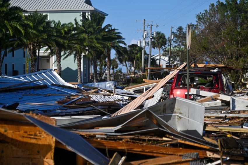 Debris left by Hurricane Helene after making landfall are seen in Cedar Key, Florida, on September 27, 2024. Hurricane Helene weakened on September 27 hours after it made landfall in the US state of Florida, with officials warning the storm remained "extremely dangerous" as it surged inland, leaving flooded roads and homes in its wake.