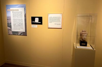 The Museum of the Bible's new exhibit, 'Sacred Words: Revealing the Earliest Hebrew Book.' On the right is an Afghan head of Buddha, dating to the 2nd century, presented to President Kennedy by Afghan King Mohammed Zahir at the White House in 1963.