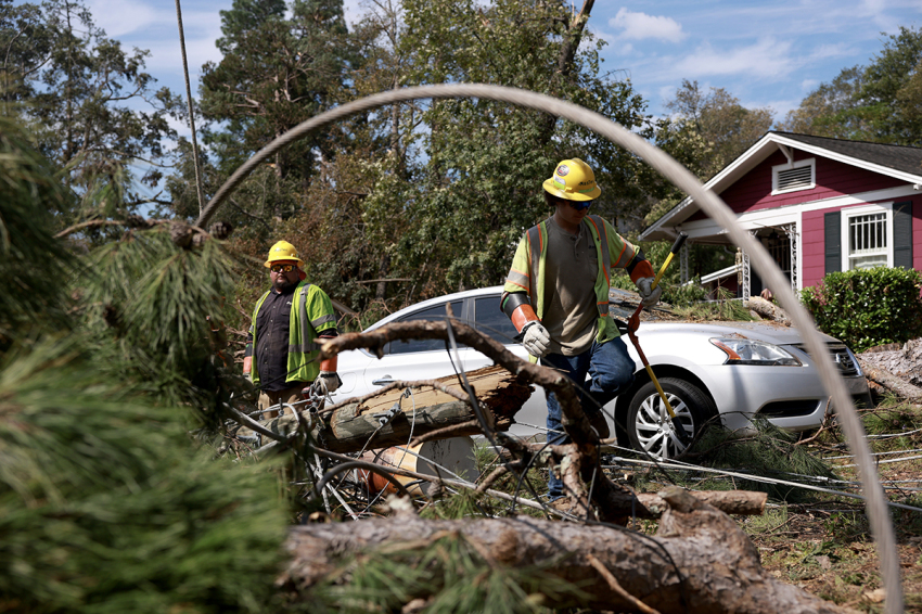 Linemen with MasTec work on restoring power after Hurricane Helene passed through the area, knocking out power to thousands of people on Oct. 05, 2024, in North Augusta, South Carolina. The Hurricane has left over 200 people dead across Florida, Georgia, North Carolina, South Carolina, and Virginia.