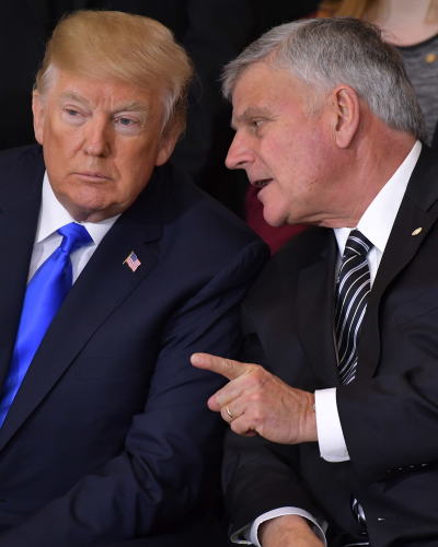 President Donald Trump listens to Franklin Graham during the memorial service for the Rev. Billy Graham in the U.S. Capitol rotunda on Feb. 28, 2018, in Washington, D.C.