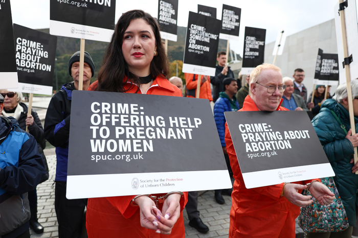 Protesters hold an 'abortion clinic buffer zone' protest outside the Scottish Parliament in Edinburgh, Scotland on September 24, 2024. A new law in Scotland bans protesters from gathering within 200 meters of clinics where abortions are performed. The anti-abortion group Society for the Protection of Unborn Children has organized protests against the measure. 