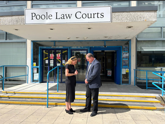 Adam Smith-Connor praying outside Poole Magistrates' Court with Isabel Vaughan-Spruce.