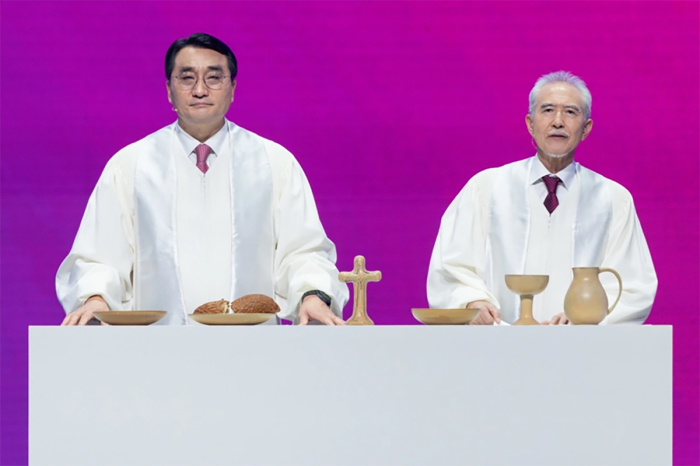 The Rev. Jaehoon Lee from South Korea and Masanori Kurasawa from Japan lead the communion service at the conclusion of the Lausanne Congress as a symbol of reconciliation in Incheon, South Korea, Sept. 28, 2024. 