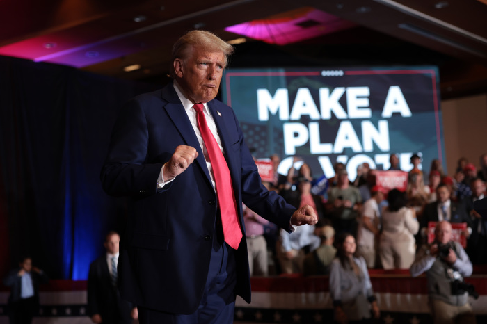 Former President Donald Trump reacts to supporters at the 11th Hour Family Leaders Meeting at the Concord Convention Center in Concord, North Carolina, on Oct. 21, 2024.