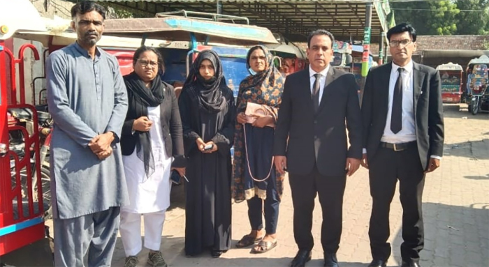 Diya Iftikhar (third from left) with her parents and attorneys after her recovery. 