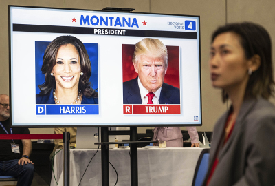 Republican candidate and former President Donald Trump and Democratic candidate and Vice President Kamala Harris are seen on a screen at an election watch party at the U.S. Embassy on Nov. 6, 2024, in Beijing, China.