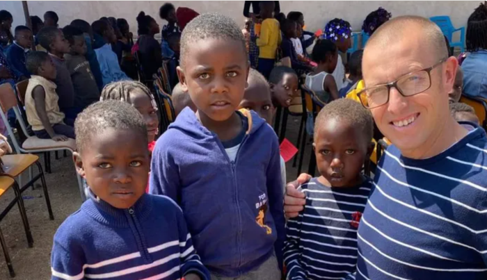 The late missionary Beau Shroyer, 44, with children in Lubango, Angola.