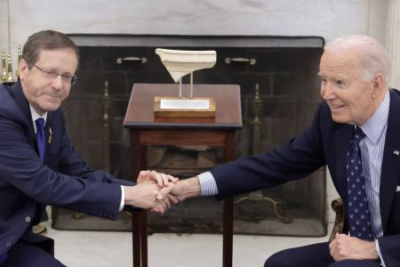 President Isaac Herzog (left) of Israel presents to U.S. President Joe Biden (right) an artifact from the foot of Temple Mount in Jerusalem during a meeting in the Oval Office of the White House on Nov. 12, 2024 in Washington, D.C. Biden met with Herzog to discuss the peace process in Gaza and Lebanon.