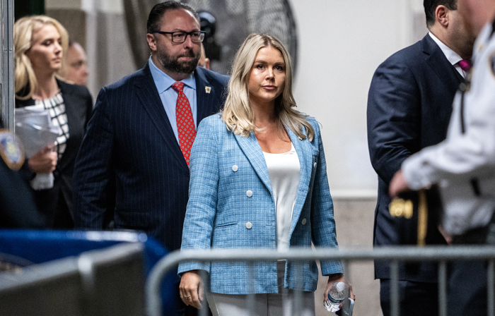 Trump campaign press secretary Karoline Leavitt (C) and Trump adviser Jason Miller (L) arrive at the criminal trial of former U.S. President and Republican presidential candidate Donald Trump's criminal trial at Manhattan Criminal Court in New York City on May 29, 2024.