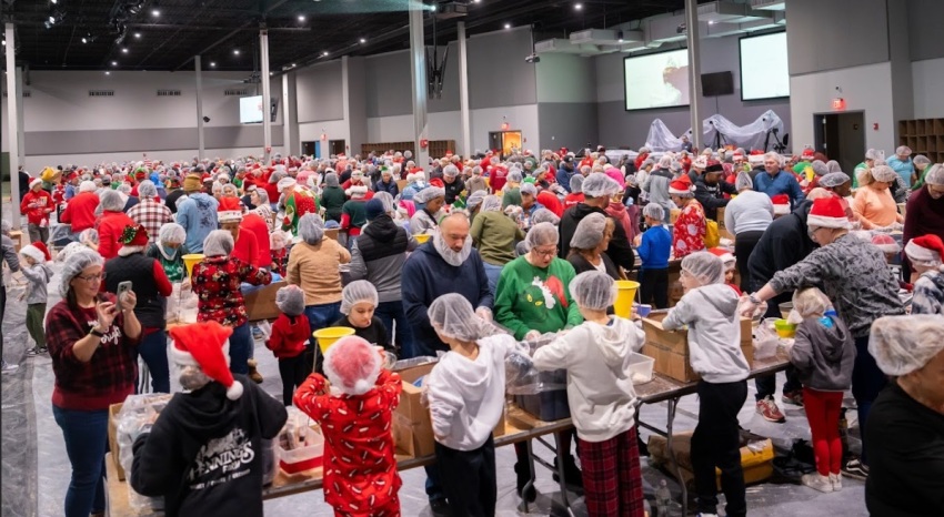 Volunteers pack meals for the needy as part of a Christmas Outreach event that was held in December 2024 at the Morris County campus of Liquid Church, located in Parsippany, New Jersey.