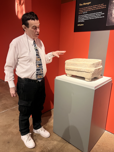 Oded Golan pictured next to a stone manger.