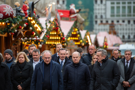 German Chancellor Olaf Scholz walks through the Christmas Market accompanied by Interior Minister Nancy Faeser and Saxony-Anhalt Premier Reiner Haseloff look as they visited the shuttered Christmas market the day after a terror attack that has left five people dead, including a small child, and 200 injured on Dec. 21, 2024, in Magdeburg, Germany. Police arrested a man after he drove a black BMW past security obstacles and into the busy Christmas market in the early evening yesterday. The attacker is reportedly a Saudi national named Taleb al-Abdulmohsen who has been living in Germany since 2006 and worked as a psychotherapist.