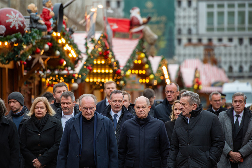German Chancellor Olaf Scholz walks through the Christmas Market accompanied by Interior Minister Nancy Faeser and Saxony-Anhalt Premier Reiner Haseloff look as they visited the shuttered Christmas market the day after a terror attack that has left five people dead, including a small child, and 200 injured on Dec. 21, 2024, in Magdeburg, Germany. Police arrested a man after he drove a black BMW past security obstacles and into the busy Christmas market in the early evening yesterday. The attacker is reportedly a Saudi national named Taleb al-Abdulmohsen who has been living in Germany since 2006 and worked as a psychotherapist.
