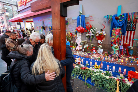 Bourbon Street terror attack victim Matthew Tenedorio's family and friends pray in front of a memorial on Bourbon Street at Canal Street on Jan. 4, 2025, in New Orleans, Louisiana. Fourteen people were killed and over 30 were injured when a driver intentionally drove into a crowd on Bourbon Street in the early morning hours of New Year's Day in what police are calling a terrorist attack.