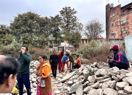People gather in an open area following earthquake tremors in Kathmandu, in the early hours on January 7, 2025. A powerful earthquake in China's remote Tibet region killed at least 32 people and collapsed 